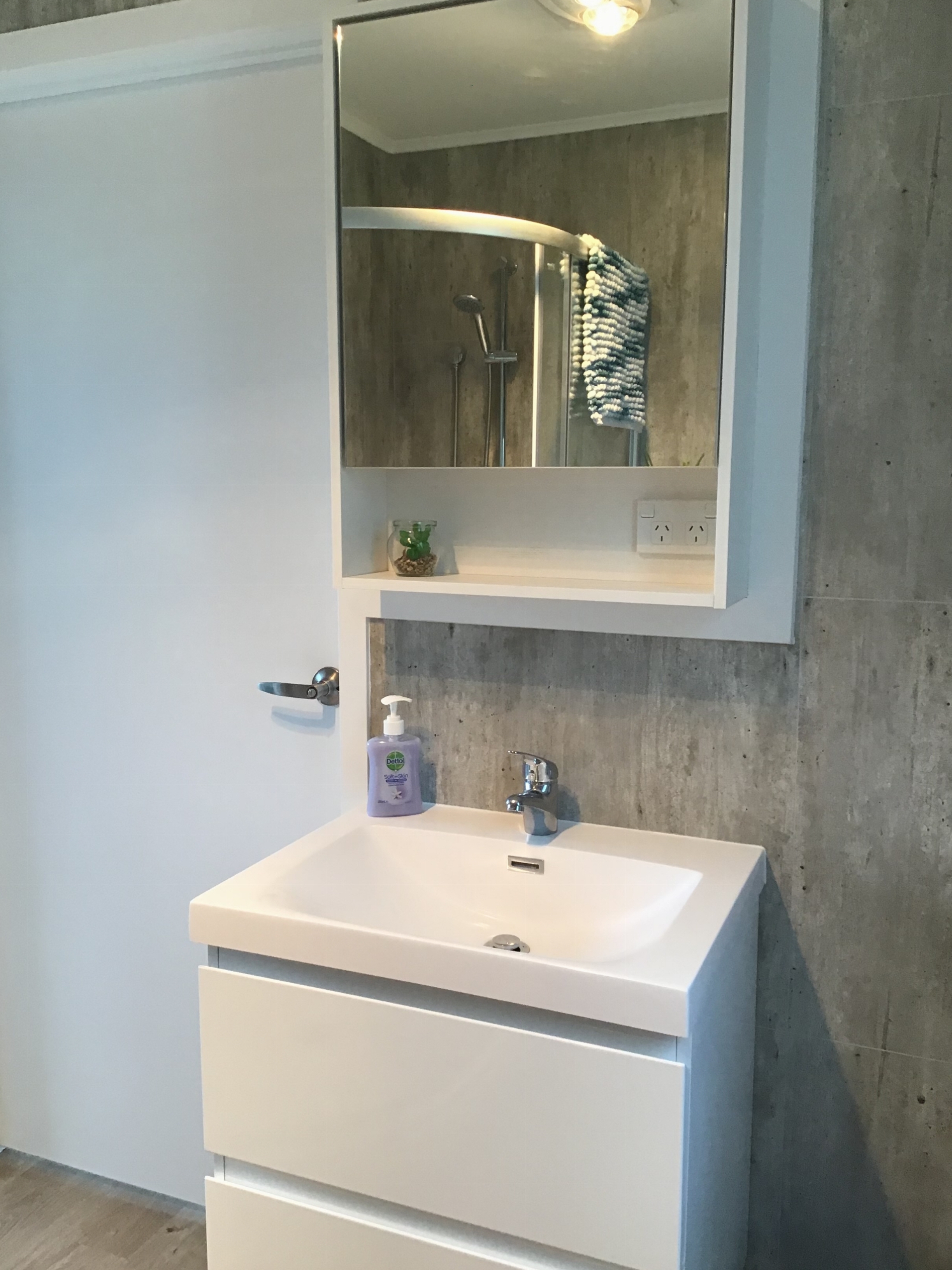 Vanity with mirror cabinet for additional storage